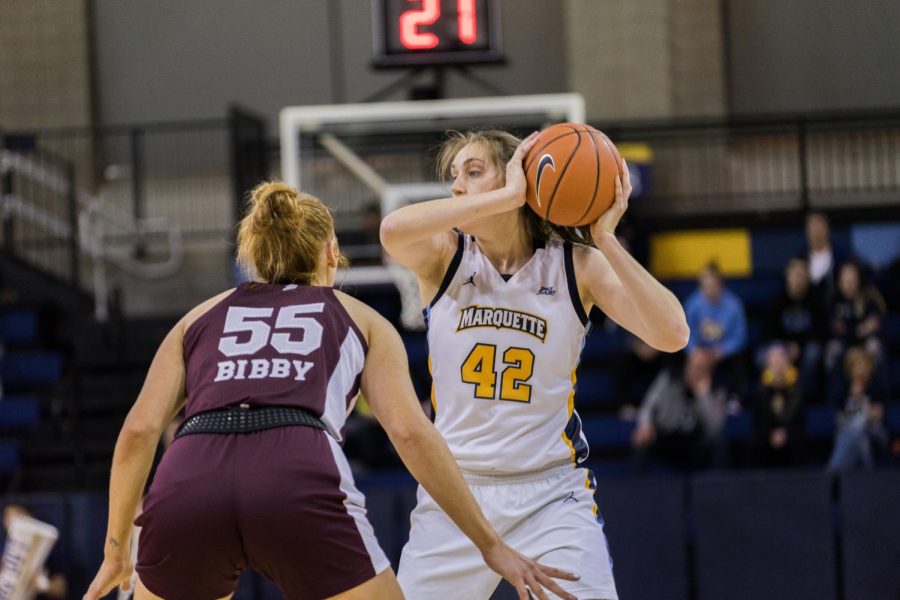 Redshirt junior forward Lauren Van Kleunen holds onto the ball in Marquettes loss to Mississippi State Nov. 25 at the Al McGuire Center.