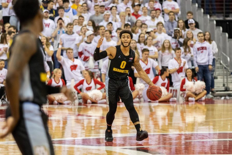Senior guard Markus Howard communicates with redshirt senior guard Sacar Anim in Marquettes 77-61 loss to Wisconsin Nov. 17 at the Kohl Center.
