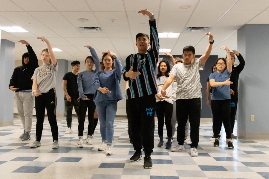 Organization members participating in the event rehearse a dance routine for their upcoming performance. The event will be a fundraiser to enhance the education of children in the Philippines. 