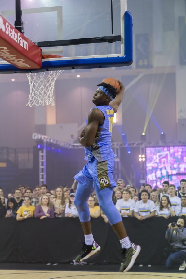 Freshman guard Dexter Akanno competes in the Marquette Madness dunk contest Oct. 4 at the Al McGuire Center.