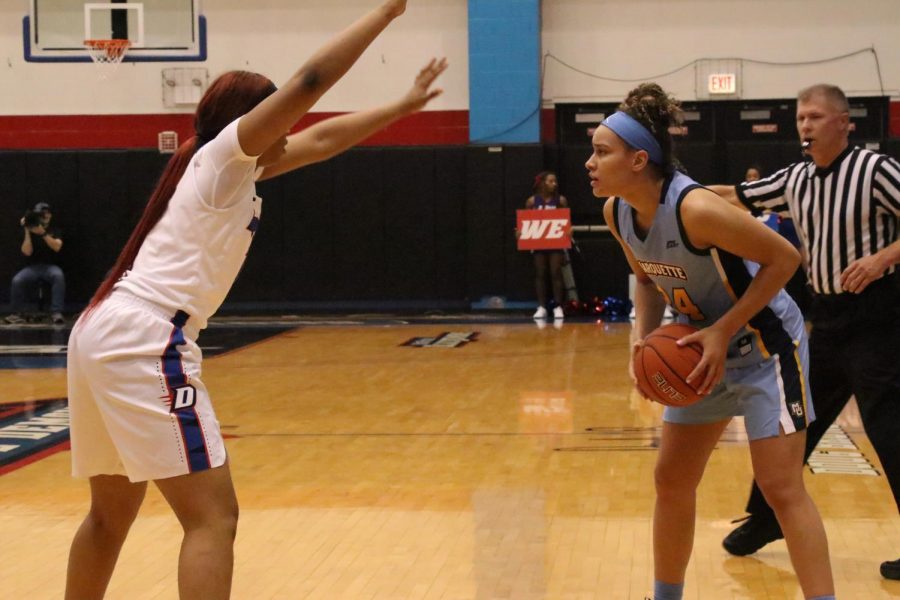 Selena Lott (24) looks for a teammate in Marquettes 89-71 loss to DePaul Sunday night. 