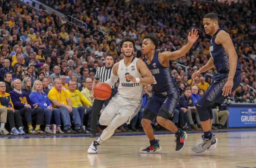Markus Howard (0) dribbles past Georgetowns defense in the Golden Eagles 86-84 loss to the Hoyas March 9, 2019 for Senior Day. This was MUs fourth straight loss to end last years regular-season. (Photo courtesy of Marquette Athletics.)