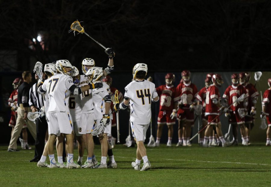 Marquette celebrating a goal in the teams 9-8 loss to the University of Denver on Apr. 26 2019