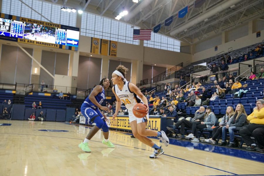 Selena Lott (24) dribbles the basketball in the Golden Eagles 81-60 victory over the Pirates Sunday afternoon. She had 19 points. 