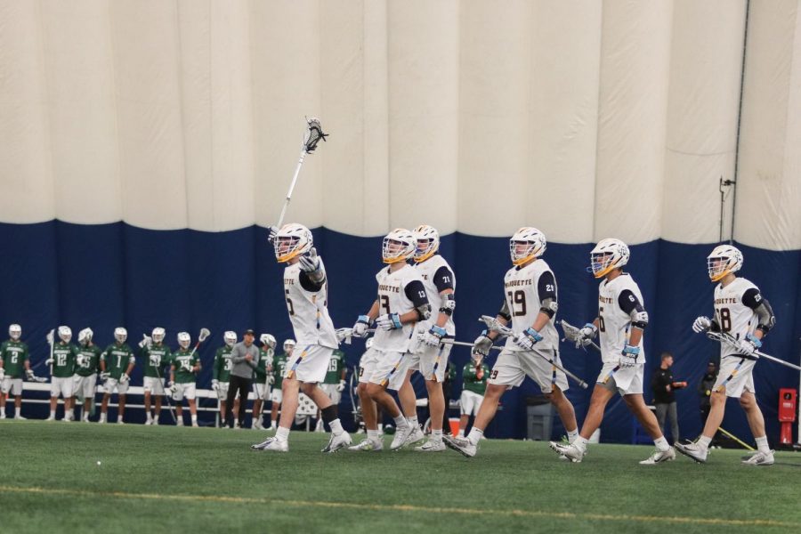 Marquette celebrates a goal in their 11-9 loss to Jacksonville on Feb. 15. 