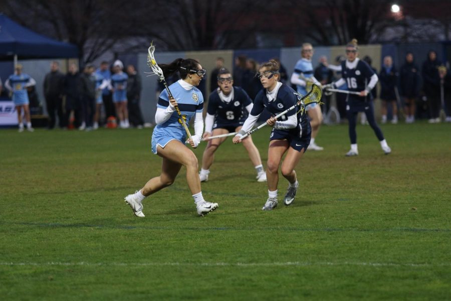 Caroline Steller (4) goes on a defender heading to the net in Marquettes 17-10 loss to Georgetown on May 2, 2019. 
(Marquette Wire Stock Photo.)