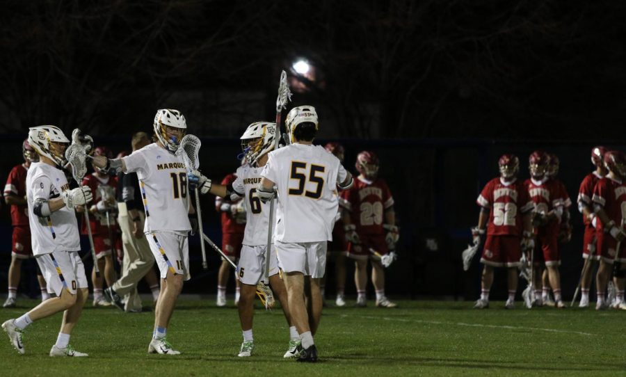 (Marquette Wire stock photo) Golden Eagles celebrating a goal in the teams 9-8 loss to Denver on April 26, 2019