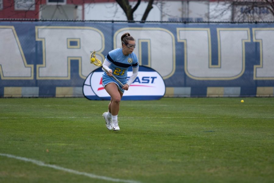Shea Garcia (21) attempts a pass in Marquettes 17-10 loss to Georgetown on May 2, 2019. (Marquette Wire stock photo.)