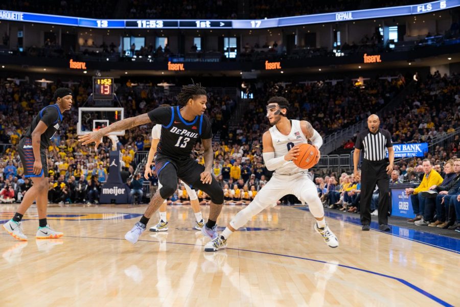 Markus Howard (0) steps back in Marquette's 76-72 win over DePaul at Fiserv Forum Saturday.