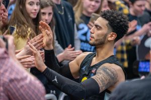 Markus Howard (0) high-fives fans after his final game at Fiserv Forum Feb. 29. 