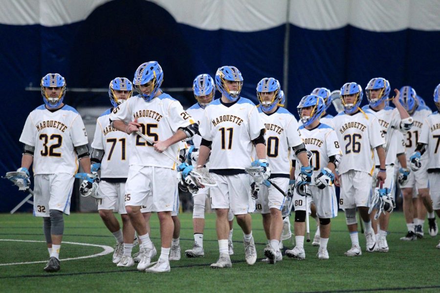 Connor Campbell (11) lines up with his teammates before Marquettes game against Ohio State in 2017. (Photo courtesy of Marquette Athletics.)