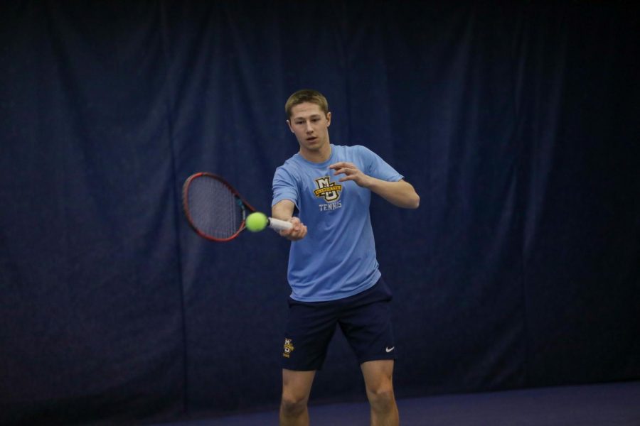 Alex+Warstler+attempts+a+forehand+at+practice+in+2020.+%28Photo+courtesy+of+Marquette+Athletics.%29