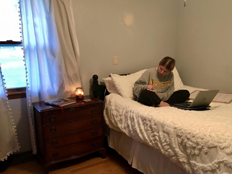Emma Brauer works in her bedroom in her new house — the spot that became her classroom, office and virtual socializing spot. Photo courtesy of Emma Brauer.