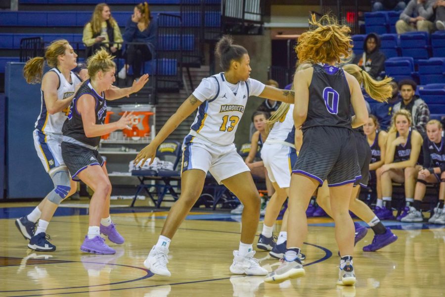 Destiny Strother (13) plays defense in Marquettes 93-47 exhibition win over Winona State on Oct. 26 2019