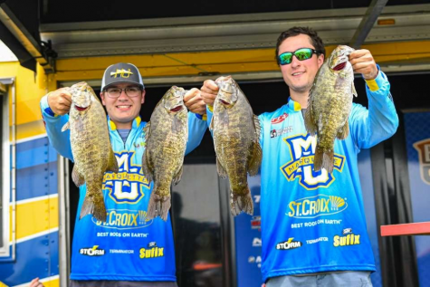 Maciek Chmielewski (left) and Michael Galeana (right) pose with their fish on St. Lawrence River in June 2019. (Photo courtesy of Michael Galeana.)