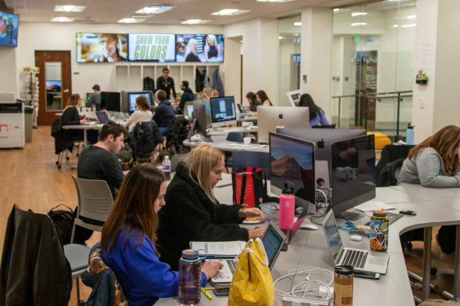 Marquette Wire reporters, editors, designers and photographers meet Dec. 2, 2019, in Johnston Hall to produce an issue of the award-winning Marquette Tribune. Marquette Wire stock photo.