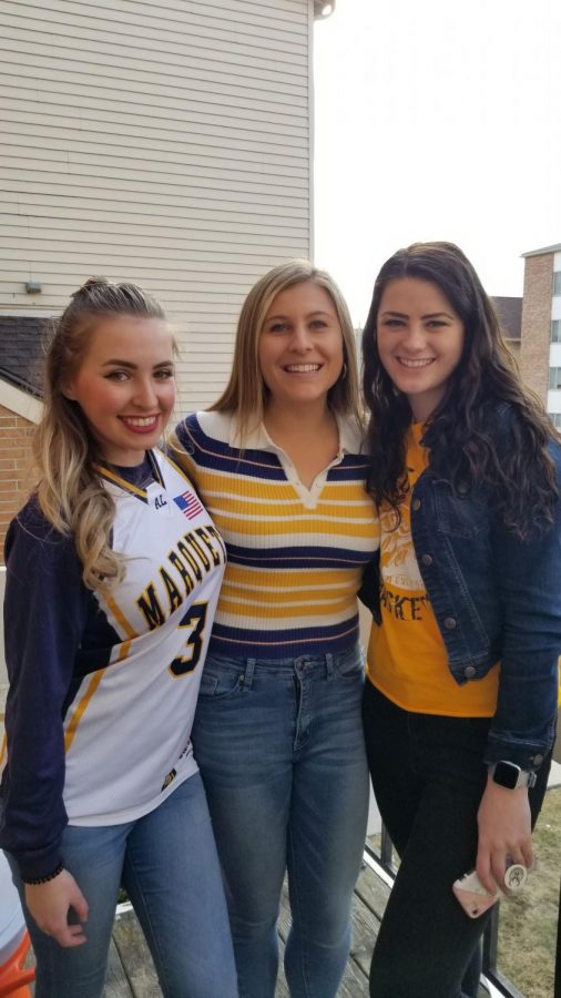 Annie Dysart (center) celebrates National Marquette Day with friends Feb. 8, 2020.