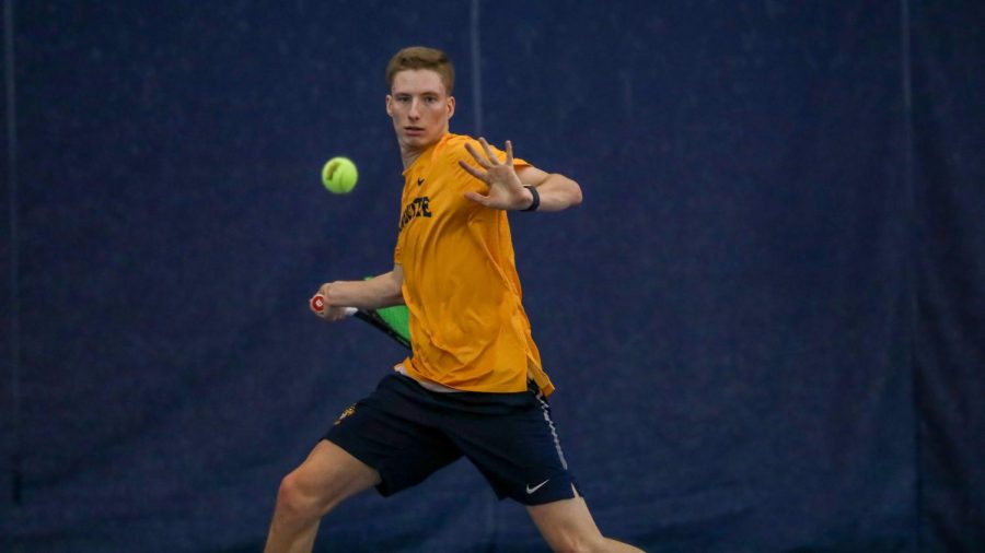 Brett Meyers hits a forehand Feb. 9 during the teams match against Valparaiso. (Photo courtesy of Marquette Athletics.)