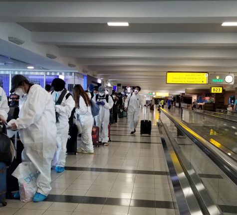 People in the airport wear protective equipment.
Photo courtesy of Henry Yang