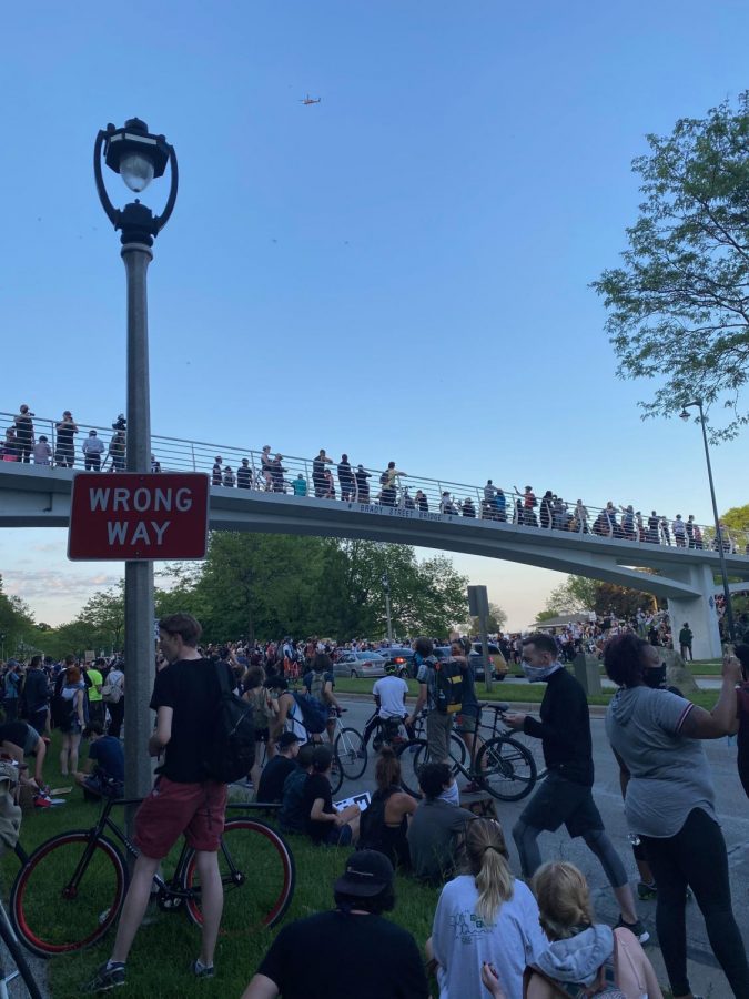 Protestors near Veteran's Park learn more about the safety precautions the organizer's set out. 