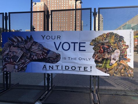 A sign that states, Your Vote is the only antidote is on the fence outside of the Wisconsin Center. 