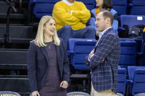 Marquette womens basketball head coach Megan Duffy speaks with Saint Johns womens basketball head coach Joe Tartamella. 