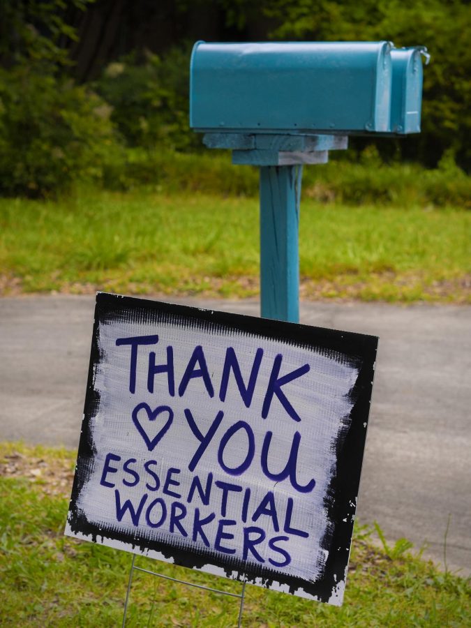 A sign showcases appreciation for essential workers. Photo via Flickr