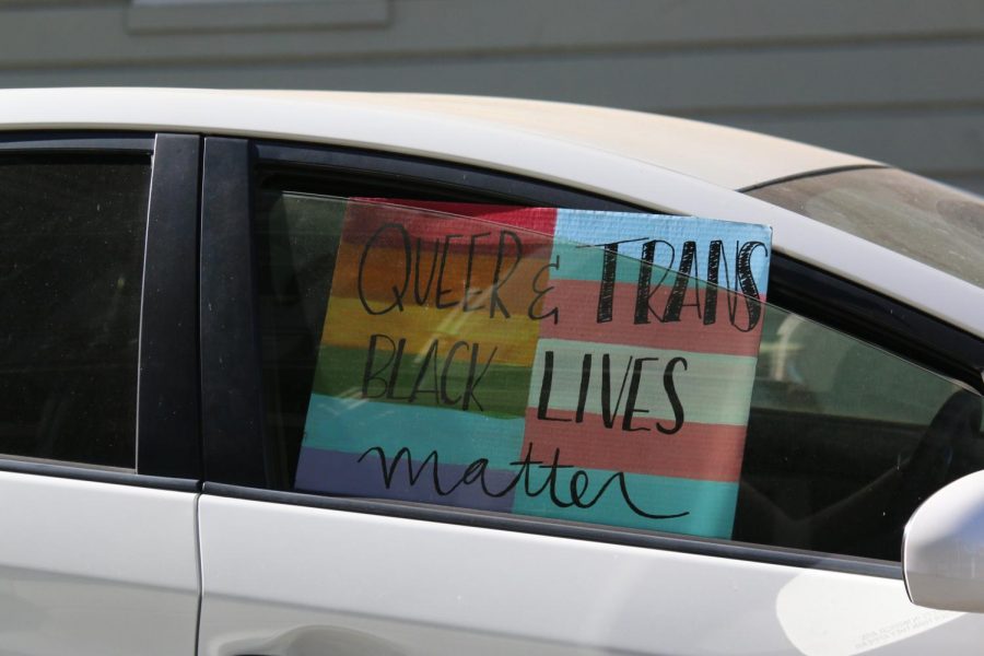 Black Lives Matter poster held outside a car window at a protest June 4. 