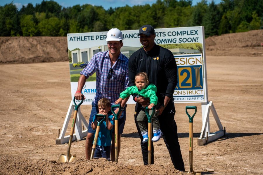 Former+Marquette+basketball+alums+Travis+Diener+%28left%29+and+Joe+Chapman+%28right%29+pose+with+their+children+at+the+groundbreaking+of+the+Athlete+Performance+Sports+Complex+Sept.+4.
