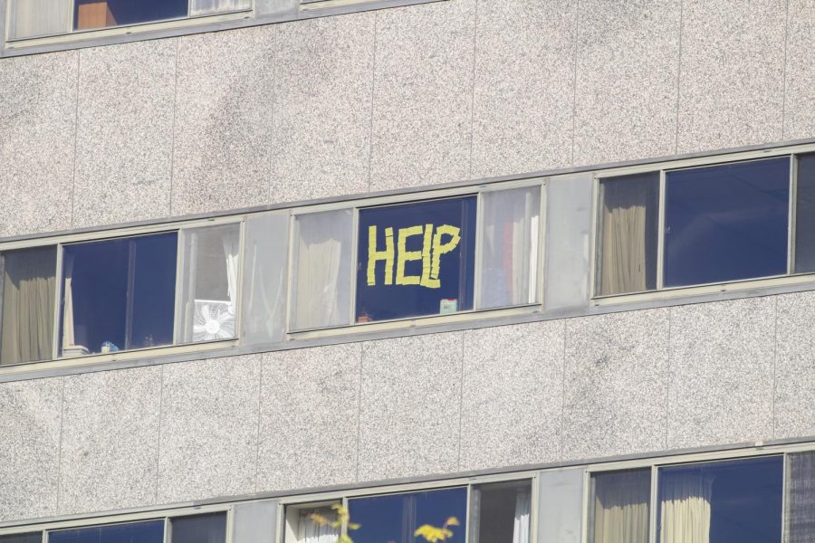 Residence of Schroeder Hall wrote notes on their windows with post-it notes.