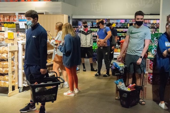 Students rushed to Sendiks Fresh2Go to get groceries before the mandatory quarantine. 