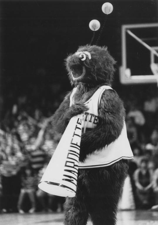Bleuteaux cheers at a Marquette basketball game, circa 1985. Photo courtesy Department of Special Collections
and University Archives, Raynor Memorial Libraries, Marquette University. 