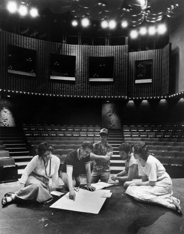 Marquette Theatre Arts students, alongside a professor, look over drawings for an upcoming performance in the Helfaer Theatre. Photo courtesy Department of Special
Collections and University Archives, Raynor Memorial Libraries, Marquette University.