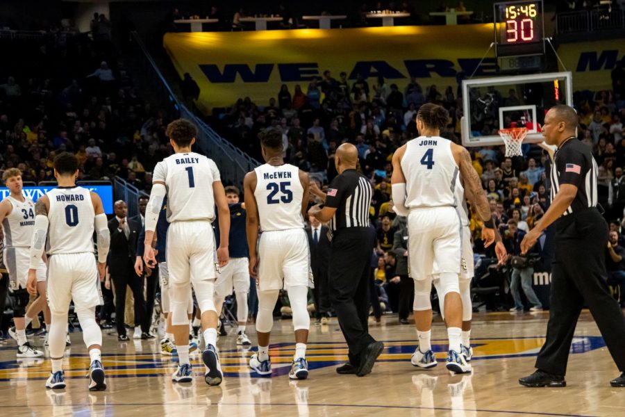 Markus Howard (0), Brendan Bailey (1), Koby McEwen (25) and Theo John (4) head to the bench during a game against Georgetown last season. 