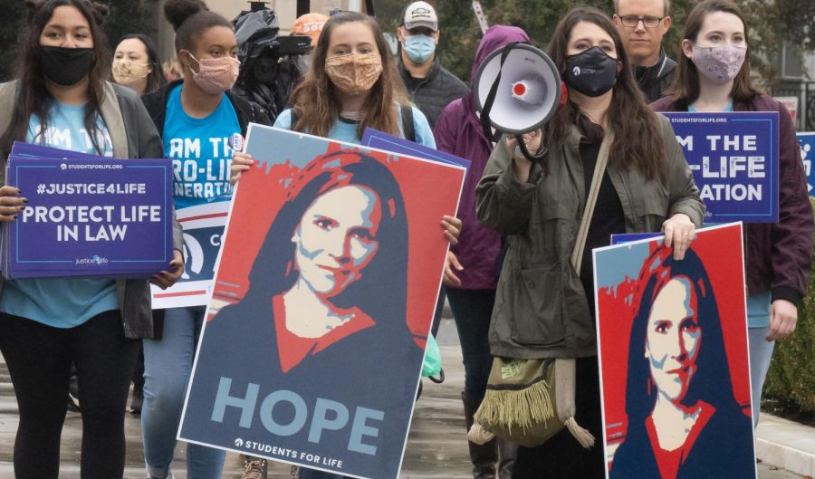 Supporters+stand+outside+the+Supreme+Court+during+the+judiciary+hearing+for+Amy+Coney+Barretts+nomination+Oct.+12.+Photo+via+Flickr