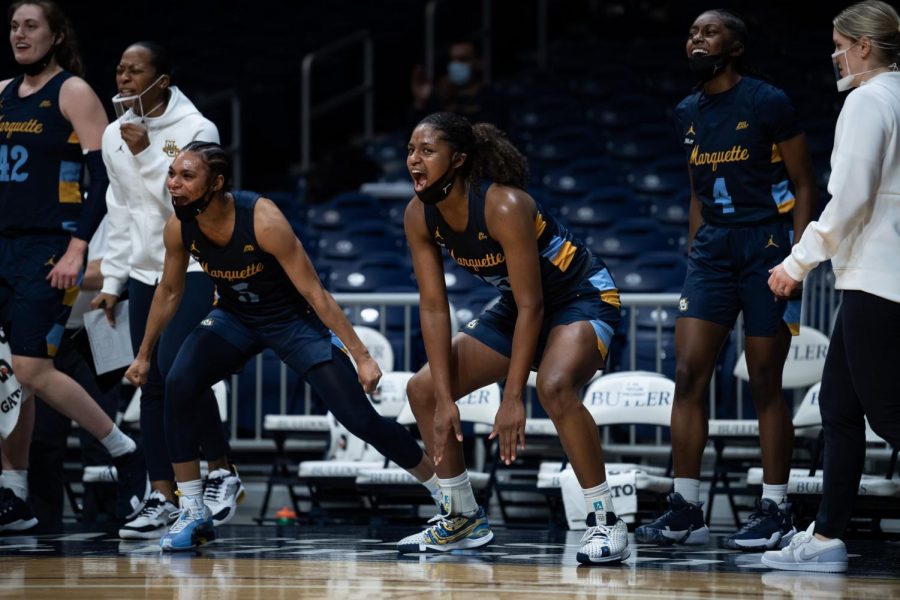 Taylor Valladay (left), Camryn Taylor (center) and Antwainette Walker (right) cheers on from the bench in Marquettes 95-56 win over Butler on Jan. 24 2020. (Photo Courtesy of Butler Athletics.)
