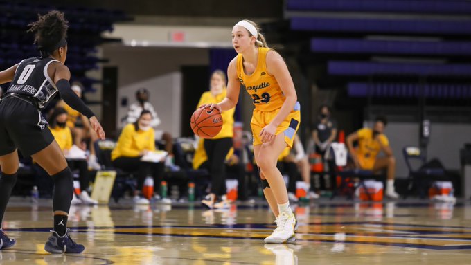 Jordan King (23) dribbles the ball in Marquettes 72-40 win over Georgetown Jan. 20. (Photo courtesy of Marquette Athletics.)