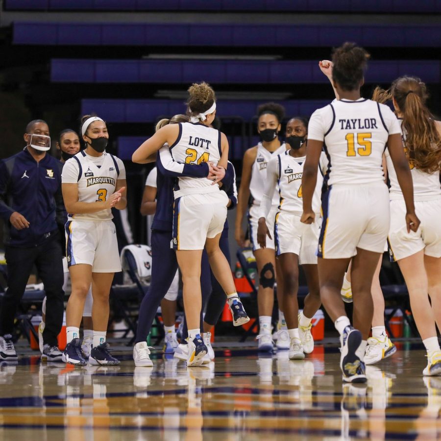 Marquette players embrace after their blowout win over Butler 77-48 (Courtesy of Marquette Athletics)  