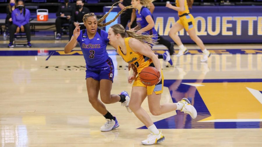 Jordan King (23) dribbles in Marquettes 87-82 loss to No. 20 DePaul Sunday afternoon at the Al McGuire Center. (Photo courtesy of Marquette Athletics.)