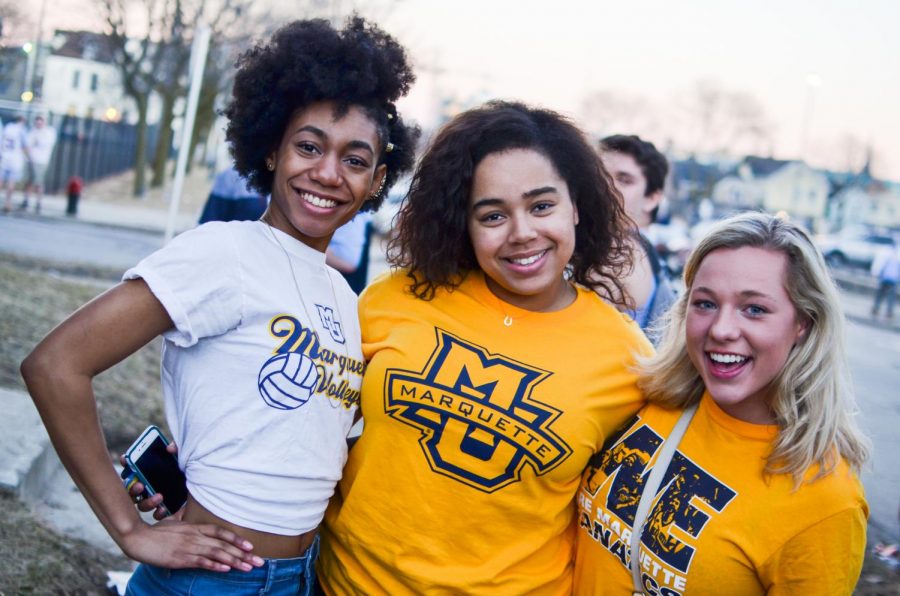 Students, faculty and alumni dress in blue and gold to show school spirit. Marquette Wire Stock Photo
