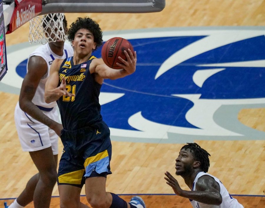 Sophomore guard D.J. Carton (21) puts up a layup against the Seton Hall Pirates on Sunday afternoon (Photo courtesy of Marquette Athletics.)