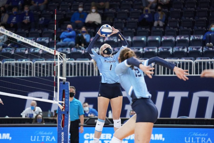 Claire Mosher (1) sets the ball in Marquettes five-set loss to Creighton Friday night. (Photo courtesy of Marquette Athletics.)