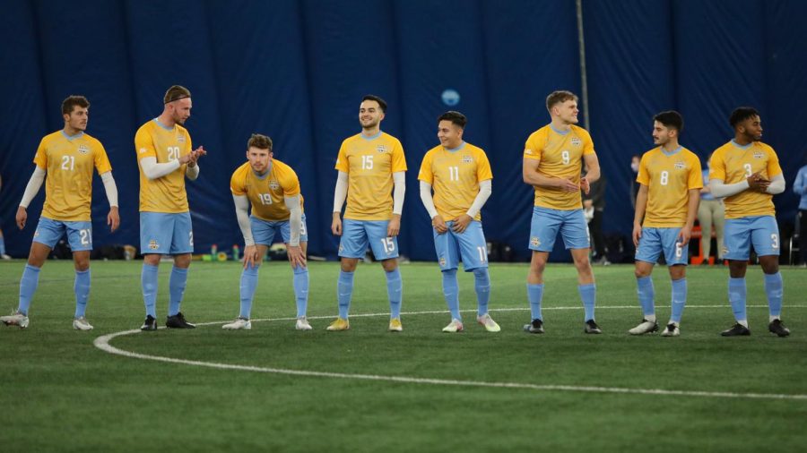 The Marquette mens soccer team lines up before their game against Loyola Chicago Feb. 3 (Photo courtesy of Marquette Athletics.)