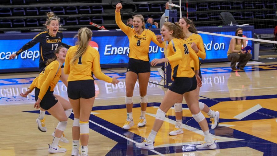 The womens volleyball team celebrates in the teams win over Iowa State Feb. 27. (Photo courtesy of Marquette Athletics.)