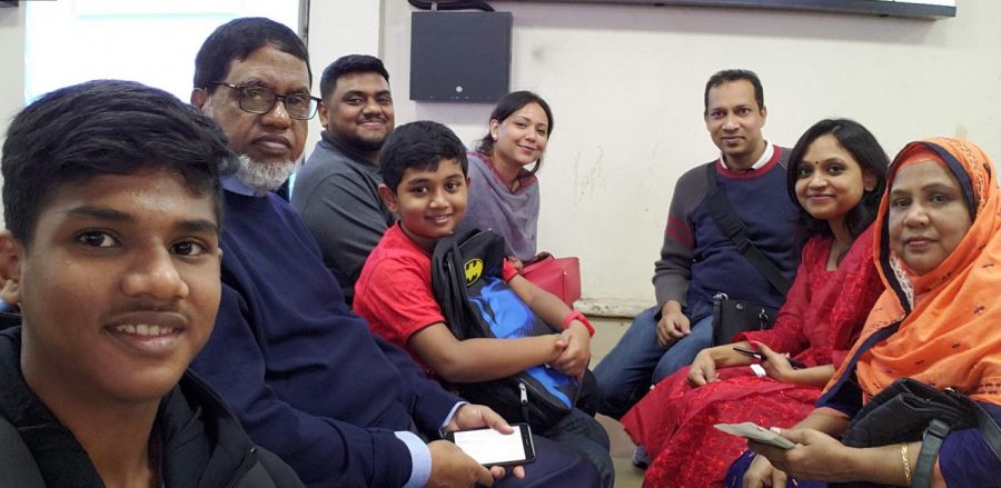 Romael Haque (third from left) smiles with his family in January 2020. Photo courtesy Romael Haque.