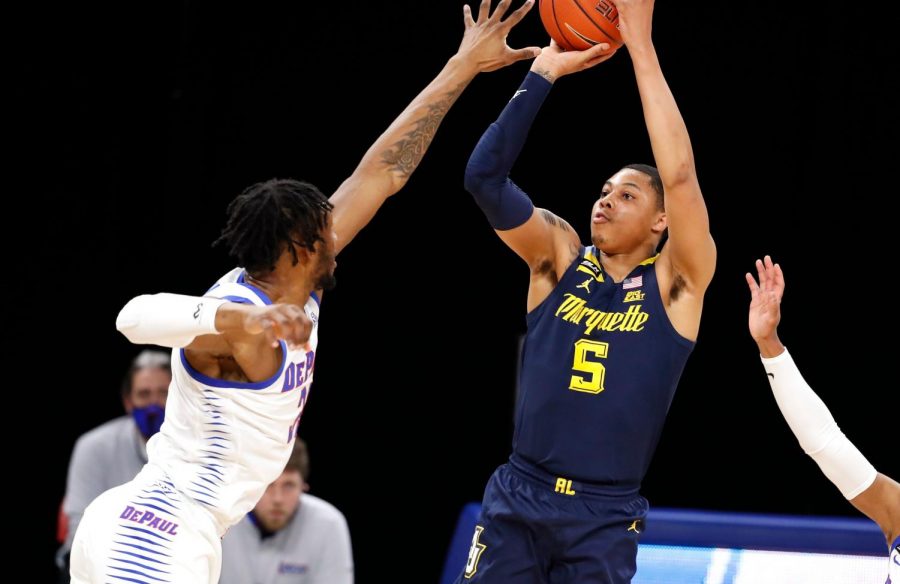 Redshirt+junior+guard+Greg+Elliott+%285%29+shoots+a+jumper+during+Marquettes+matchup+with+the+DePaul+Blue+Demons+on+Tuesday+night+%28Photo+courtesy+of+Marquette+Athletics.%29