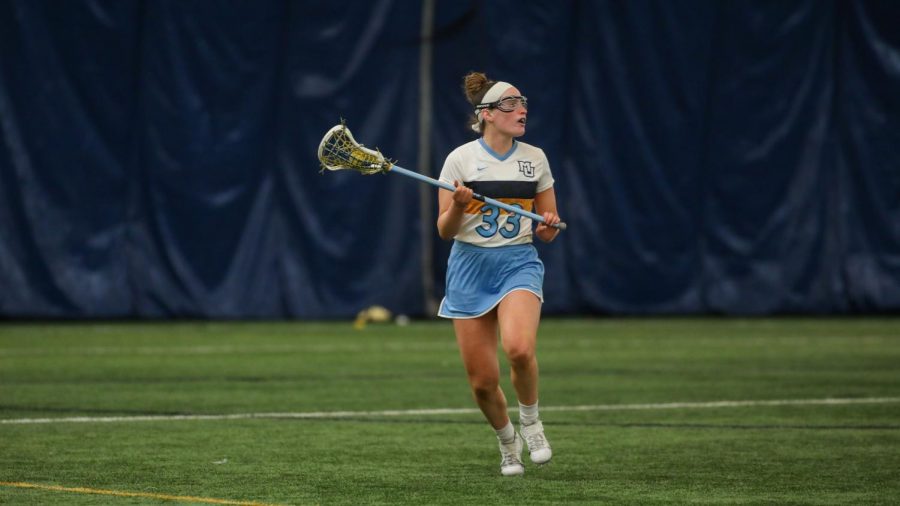 Senior+defender+Erin+Dowdle+%2833%29+looks+to+make+a+play+downfield+%28Photo+courtesy+of+Marquette+Athletics.%29