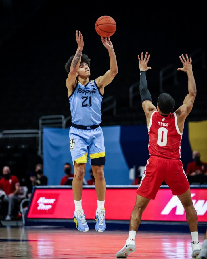 D.J. Carton (21) shoots a shot in Marquettes 67-65 win over then-No. 4 Wisconsin Dec. 4. (Photo courtesy of Marquette Athletics.)
