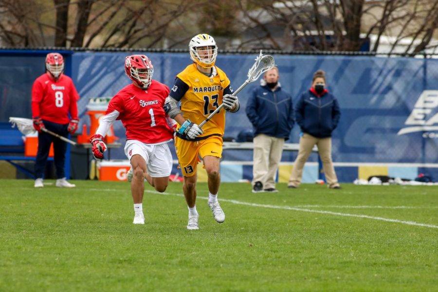 Redshirt+senior+midfielder+Connor+McClelland+%2813%29+looks+on+after+moving+past+a+St.+Johns+defender+April+14.+He+posted+a+hat+trick+Saturday+afternoon+against+the+Villanova+Wildcats+%28Photo+courtesy+of+Marquette+Athletics.%29