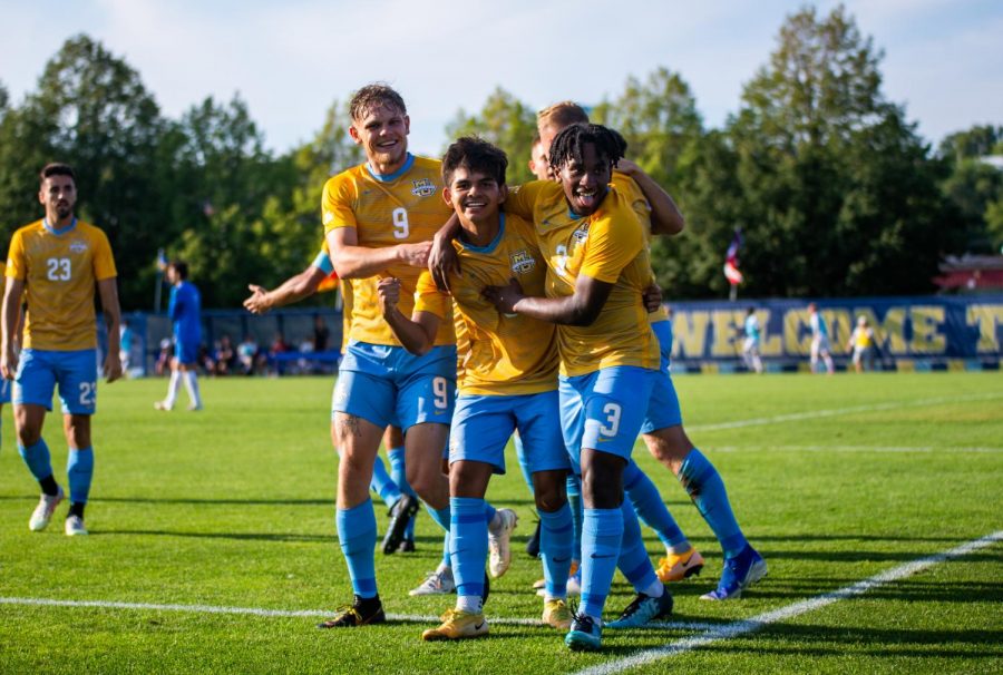 No.19+Marquette+mens+soccer+celebrates+after+Edrey+Caceres+s%28center+middle%29+goal.+